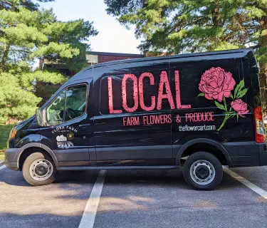 Image of a wrapped local flowers and produce van