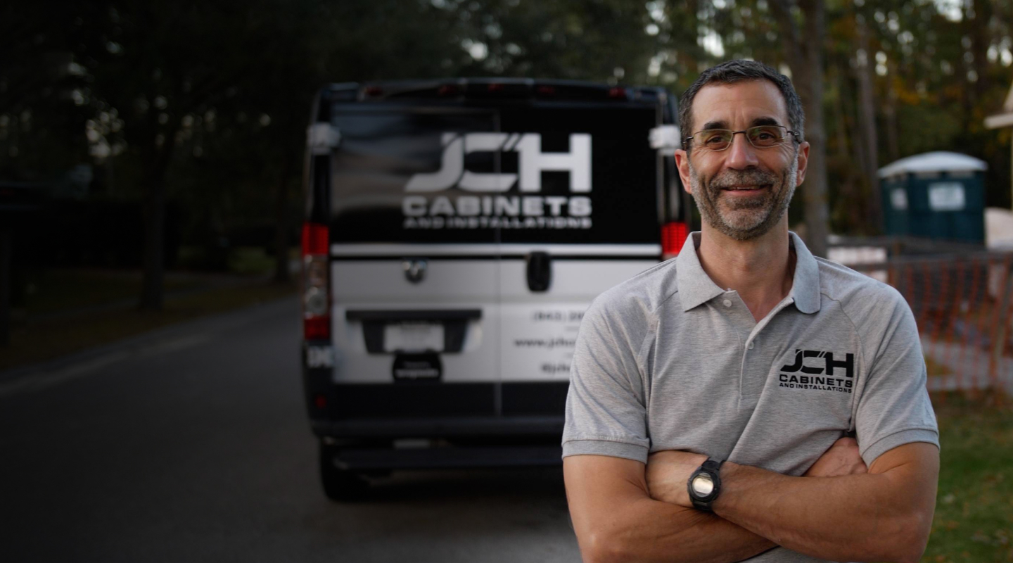 Image of John from JCH Cabinets with his wrapped van.