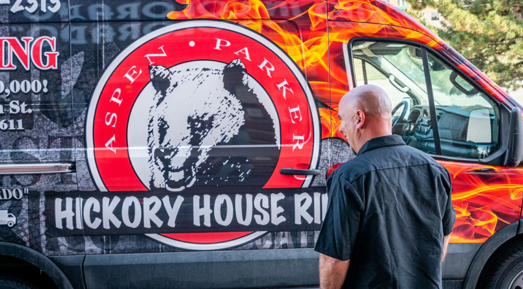 Image of a wrapped van from Hickory House Ribs.
