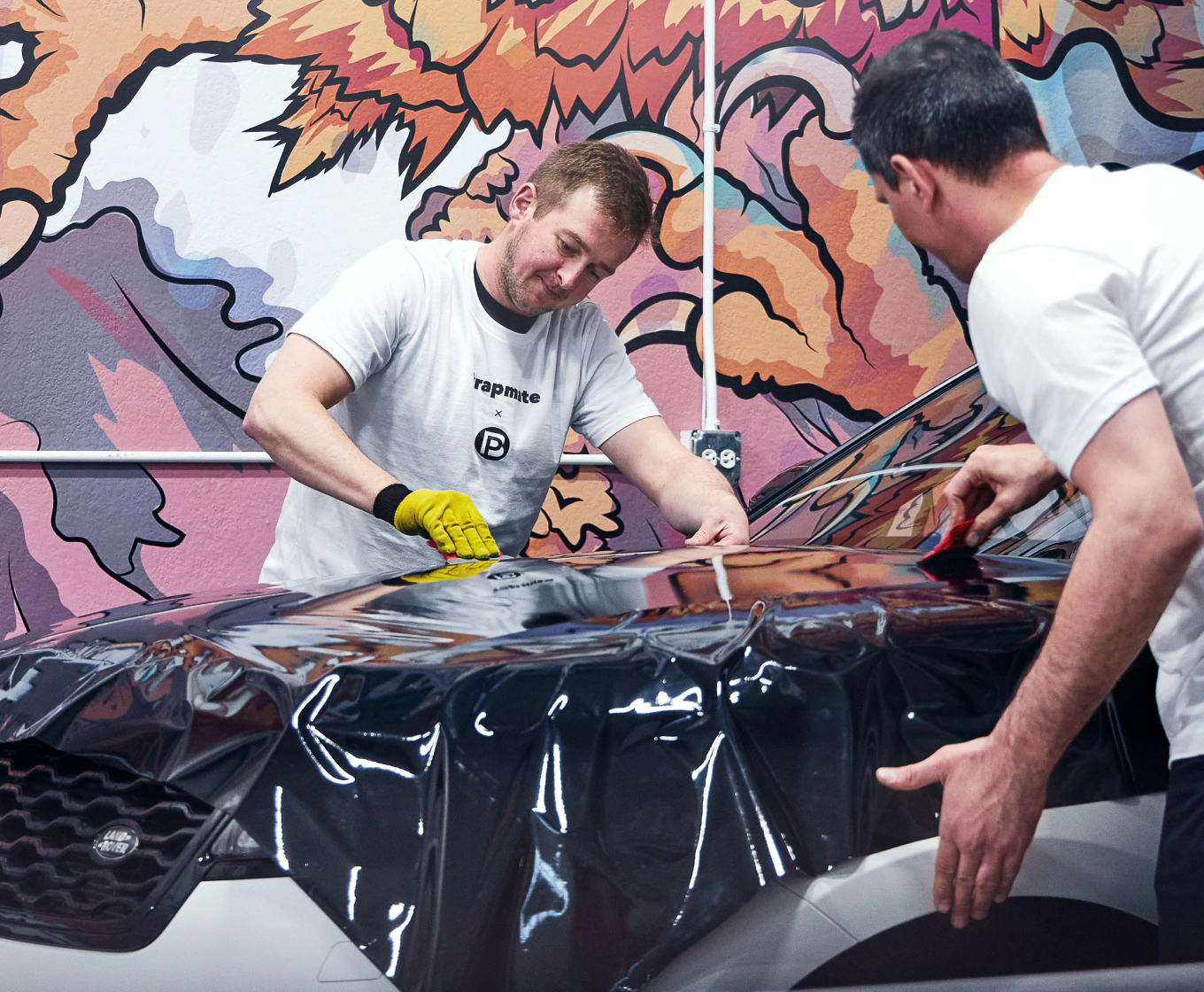 image of pros installing a vehicle wrap