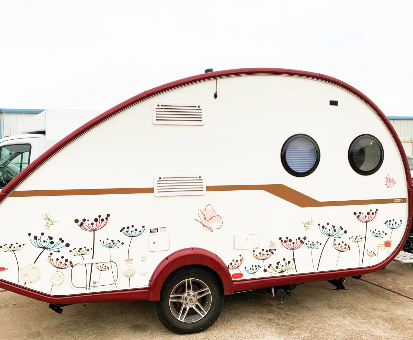 image of a wrapped trailer with some flowers and butterflies