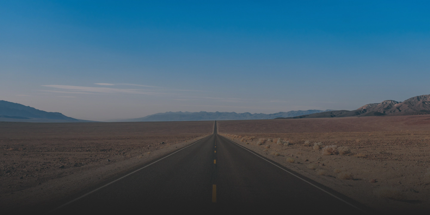 image of a long desert road